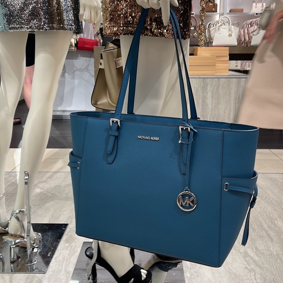 Michael Kors Gilly Large Drawstring Travel Leather Top Zip Tote
 Color: TEAL
NWT - Picture 2 of 16